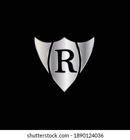 Silver Shield Logo Design for Letter R. Vector Realistic Metallic logo Template Design for Letter R. Silver Metallic Logo. Logo Design for car, safety companies and others.