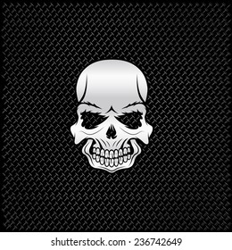 silver skull on metal background