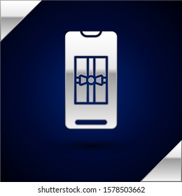 Silver Smartphone with gift box on the screen icon isolated on dark blue background. Merry Christmas and Happy New Year.  Vector Illustration