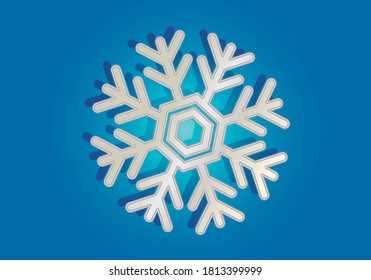 El copo de nieve plateado sobre fondo azul.