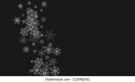 Silver snowflakes frame on black background. Horizontal shiny Christmas and New Year frame for gift certificate, ads, banners, flyers. Falling snow with glitter silver snowflakes for party invite