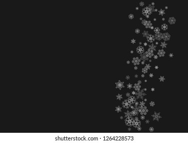 Silver snowflakes frame on black background. Horizontal shiny Christmas and New Year frame for gift certificate, ads, banners, flyers. Falling snow with glitter silver snowflakes for party invite