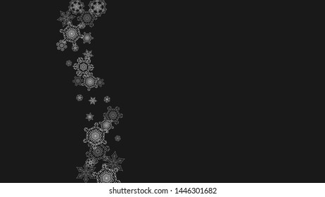 Silver snowflakes frame on black background. Horizontal shiny Christmas and New Year frame for gift certificate, ads, banners, flyers. Falling snow with glitter silver snowflakes for party invite