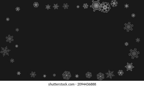 Silver snowflakes frame on black background. Horizontal shiny Christmas and New Year frame for gift certificate, ads, banners, flyers. Falling snow with glitter silver snowflakes for party invite