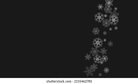Silver snowflakes frame on black background. Horizontal shiny Christmas and New Year frame for gift certificate, ads, banners, flyers. Falling snow with glitter silver snowflakes for party invite