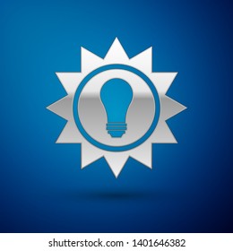 Silver Solar energy panel icon isolated on blue background. Sun and light bulb. Vector Illustration