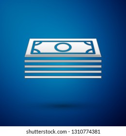 Silver Stacks paper money cash icon isolated on blue background. Money banknotes stacks. Bill currency. Vector Illustration