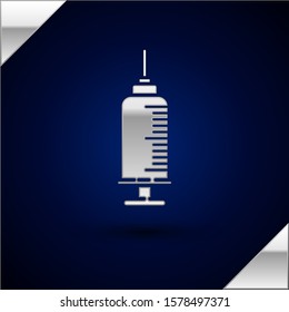 Silver Syringe with pet vaccine icon isolated on dark blue background. Dog or cat paw print.  Vector Illustration