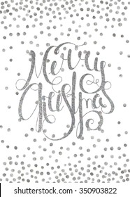 Silver textured handwritten calligraphic inscription Merry Christmas with pattern of silver confetti. Design element for banner, card, invitation, postcard, template and vignette. Vector illustration.