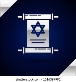 Silver Torah scroll icon isolated on dark blue background. Jewish Torah in expanded form. Star of David symbol. Old parchment scroll.  Vector Illustration