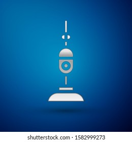 Silver Vacuum cleaner icon isolated on blue background.  Vector Illustration