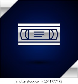 Silver VHS video cassette tape icon isolated on dark blue background.  Vector Illustration