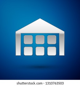 Silver Warehouse icon isolated on blue background. Vector Illustration