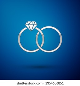 Silver Wedding rings icon isolated on blue background. Bride and groom jewelery sign. Marriage icon. Diamond ring. Vector Illustration