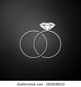 Silver Wedding rings icon isolated on black background. Bride and groom jewelery sign. Marriage icon. Diamond ring icon. Long shadow style. Vector.