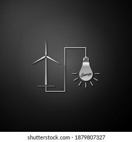 Silver Wind mill turbine generating power energy and light bulb icon isolated on black background. Natural renewable energy production using wind mills. Long shadow style. Vector.