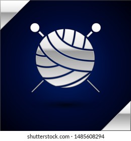 Silver Yarn ball with knitting needles icon isolated on dark blue background. Label for hand made, knitting or tailor shop.  Vector Illustration