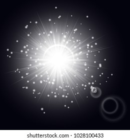 Silvery light effect with shining rays and bright particles of stellar dust on a black background