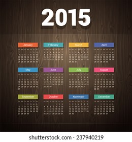 Simple 2015 calendar on Dark Wooden Background.