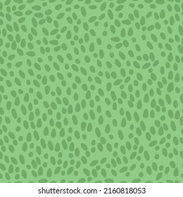 Simple abstract pattern. green spots and dots on a light green background. fashionable print for textiles, wallpaper and packaging.