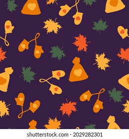 Simple autumn pattern. cute orange hats and mittens, colored maple leaves. purple background. vector texture. Print for banners and wallpapers.