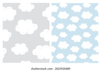 Simple Baby Shower Seamless Vector Pattern. Infantile Style White Grunge Clouds Isolated on a Light Gray and Pastel Blue Background. Cloudy Sky Irregular Print ideal for Wrapping Paper.