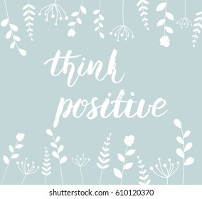Simple background with "think positive" handwritten calligraphy message and abstract flowers.
