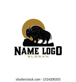 Simple Bison logo vector icon. with rock field and sun Silhouette classic modern look.  