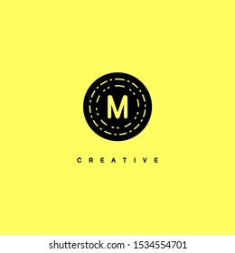 simple black circle vintage retro M logo letter isolated on yellow background design concept
