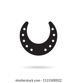 Simple black horseshoe vector icon isolated on white background. Horse shoe silhouette as international good luck symbol. Fortune and success sign