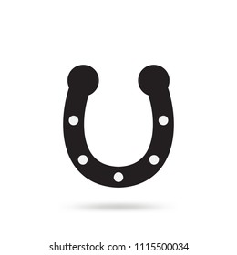 Simple black horseshoe vector icon isolated on white background. Horse shoe silhouette as international good luck symbol. Fortune and success sign