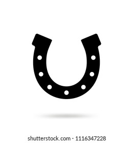 Simple black horseshoe vector icon isolated on white background. Horse shoe silhouette as international good luck symbol. Fortune and success sign