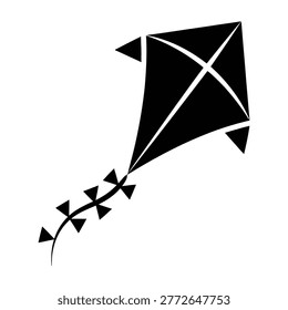 A simple black kite with white lines and tail streamers flying high in the sky, evoking a sense of freedom and joy