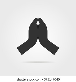 simple black praying hands with shadow. concept of praise, support, blessing, shrift, hinduist, gratitude, bible. isolated on gray background. flat style trend modern logo design vector illustration
