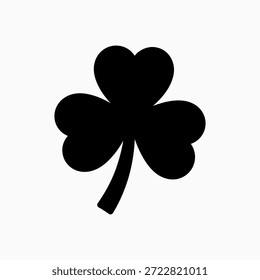 Simple black shamrock or clover leaf silhouette icon isolated on white background. Minimalist graphic symbol for Irish themes and St. Patrick's Day designs.