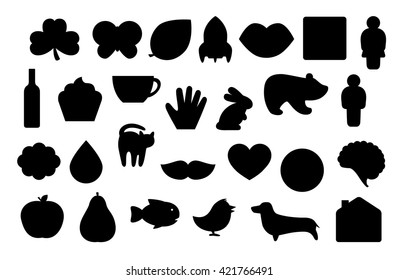 Simple black silhouettes of different animals, plants and objects