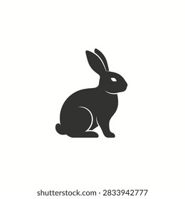 A simple black vector graphic showing a rabbit in a sitting pose on a white background