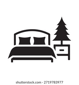 Simple black and white icon of a bed and bedside table with a tree