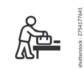 A simple black and white icon showing a stylized figure placing a briefcase on a table or counter. Ideal for business, travel, or workplace concepts.