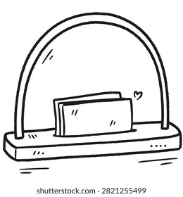 A simple black and white line drawing of a minimalist desk lamp featuring a small paper holder or note organizer on its base with a heart symbol.