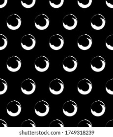 Simple black and white seamless vector background of circles. Black background with white rings. Design for fabrics, print, web, packaging and other uses.