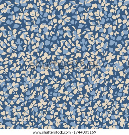 Simple botanical background. Nature ornament. Seamless pattern made of flat stylized flower buds. Glade of small modest daisies. Trendy flat illustration. Fashion, textile and fabric application.