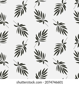 Simple botanical seamless pattern. Silhouettes of tropical leaves. Minimalistic monochrome design for fabric, wallpaper, packaging, background.