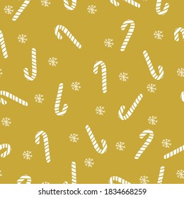 Simple Christmas pattern. Cute white ornament caramel cane and snowflakes. Mustard background. Vector texture. Bright print for Wallpaper.