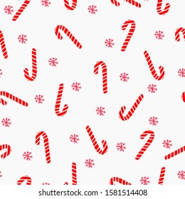 Simple Christmas pattern. White background, candy cane and snowflakes. The print is well suited for textiles, banners, Wallpaper and packaging, postcards.