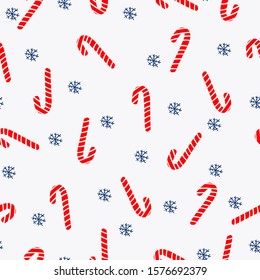 Simple Christmas pattern.Light background, cute caramel cane, blue snowflakes. The print is well suited for textiles, postcards and banners, packaging.