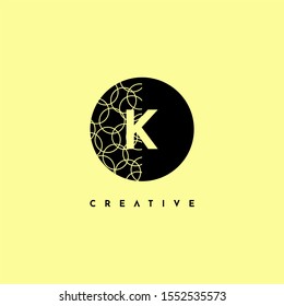 simple circle K logo letter with half patterned creative design concept isolated on yellow background