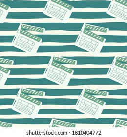 Simple clapperboard doodle seamless pattern. Dark turquoise and white colored pattern with cinema print. Decorative backdrop for wallpaper, textile, wrapping paper, fabric print. Vector illustration.