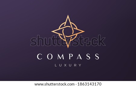 simple compass logo concept in a modern and luxury style with gold color