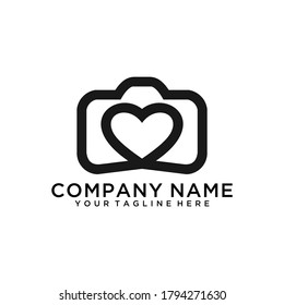 Simple creative wedding photographer symbol, icon, logo consisting of camera and heart.